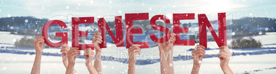 People Hands Holding Word Genesen Means Recover, Snowy Winter Background