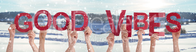 People Hands Holding Word Good Vibes, Snowy Winter Background