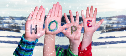 Children Hands Building Word Hope, Snowy Winter Background