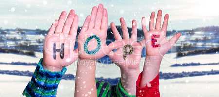 Children Hands Building Word Hope, Snowy Winter Background