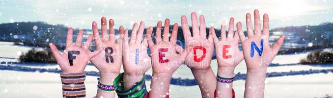 Children Hands Building Word Frieden Means Peace, Snowy Winter Background