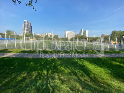 football field near fence at day sunny summer day