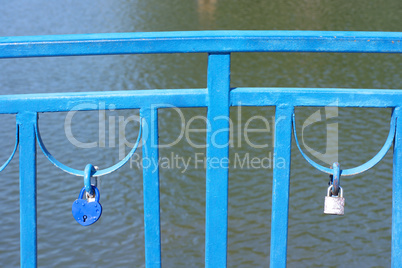 railing over pond at dry sunny summer day