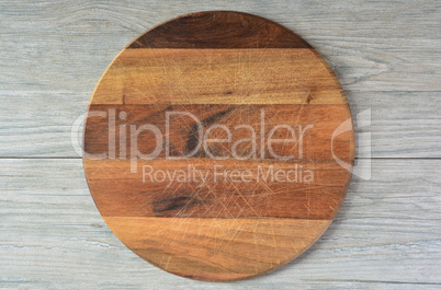 Round wooden chopping board, top view
