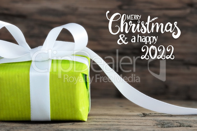 One Green Gift, White Bow, Wooden Background, Merry Christmas And A Happy 2022