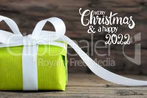 One Green Gift, White Bow, Wooden Background, Merry Christmas And A Happy 2022