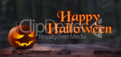 Carved halloween pumpkin Jack o lantern on a rustic wooden plank