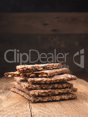 Stacked organic crispbread on a rustic wooden table