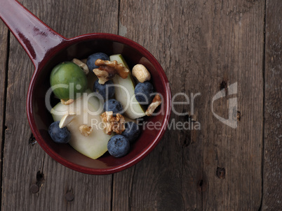 Organic food in a bowl on wood