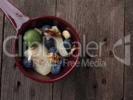 Organic food in a bowl on wood