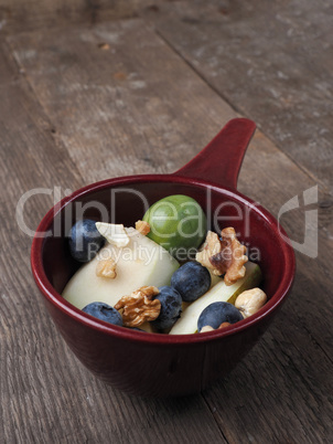 Organic food in a bowl on a wooden table