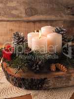 First Advent candle burning, traditional Christmas decoration