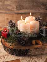 Fourth Advent candle burning, traditional Christmas decoration