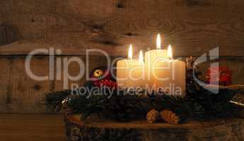 Fourth Advent candle burning, traditional Christmas decoration