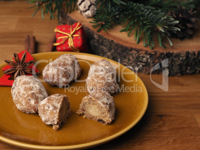 Delicious Christmas stollen on a ceramic plate in front of an Ad