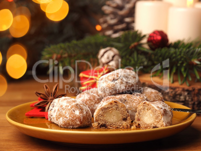 Delicious Christmas stollen on a ceramic plate in front of an Ad