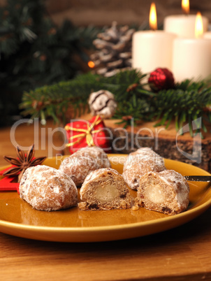 Delicious Christmas stollen on a ceramic plate in front of an Ad