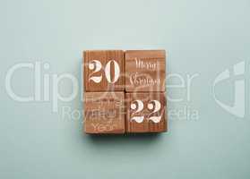 Four wooden cubes with the text Merry Christmas, Happy New Year
