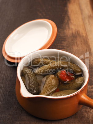 Gherkins in a rustic ceramic bowl