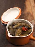 Gherkins in a rustic ceramic bowl