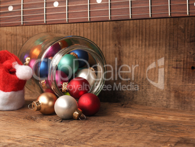 Colorful Christmas balls in glass with a fingerboard of an elect