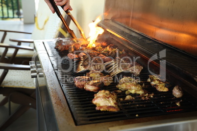 Fried meat on a gas grill, close-up