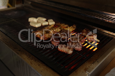 Fried meat on a gas grill, close-up