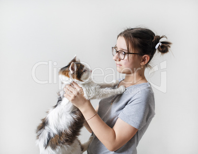 girl holding cat