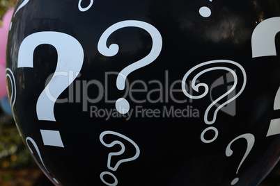 black balloon with question marks for gender reveal party