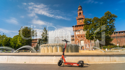 Electric scooter near Castello Sforzesco - Sforza Castle in Milan, Italy.