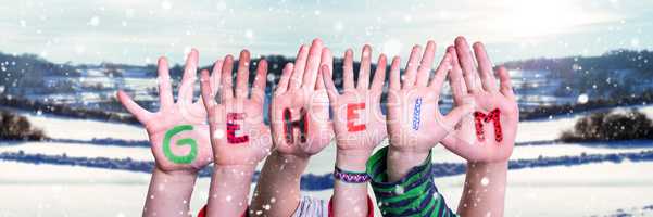 Children Hands Building Word Geheim Means Secret, Snowy Winter Background