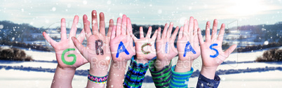 Many Children Hands Building Gracias Means Thank You, Snowy Winter Background