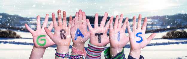 Children Hands Building Word Gratis Means Free, Snowy Winter Background