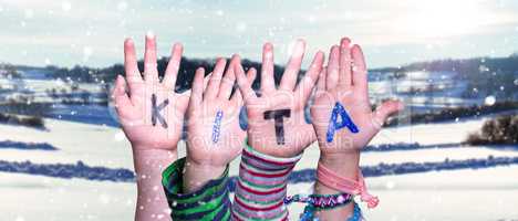 Children Hands Building Word KITA Means Kindergarden, Snowy Winter Background