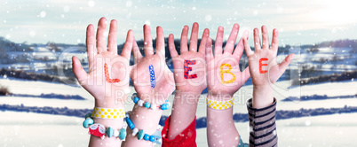 Children Hands Building Word Liebe Means Love, Snowy Winter Background