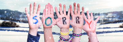 Children Hands Building Word Sorry, Snowy Winter Background