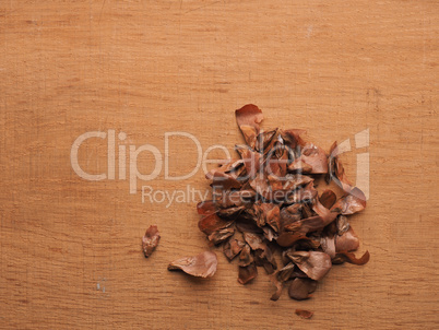 Seeds of a Nordmann fir on a wooden background
