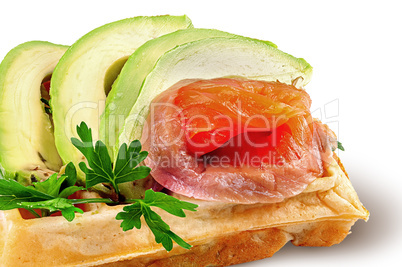 Closeup french waffle with avocado and salmon