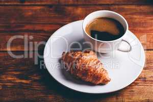 Cup of Black Coffee and Fresh Croissant