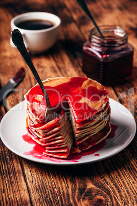 Stack of pancakes with berry fruit marmalade