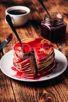 Stack of pancakes with berry fruit marmalade