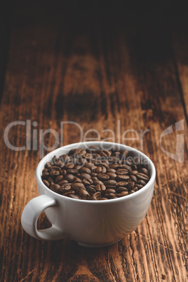 Roasted coffee beans in cup