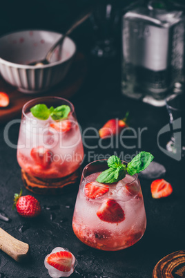 Cocktail with strawberry, gin and tonic