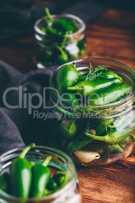 Canned Jalapeno Peppers, Garlic And Dill in Glass Jars