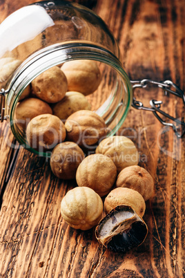 Whole and crushed dried limes on wooden table
