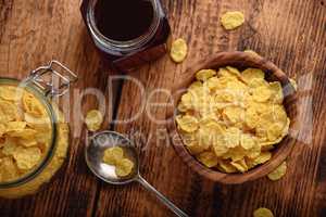 Breakfast with corn flakes, milk and jam