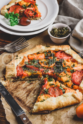 Sliced tomato galette on baking paper