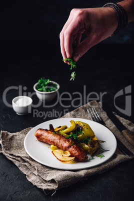 Pork sausage with bell peppers, onions and different herbs