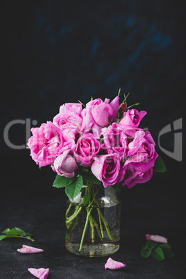 Small pink garden roses in vase