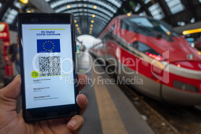 Woman showing on smartphone EU Digital Covid Certificate.